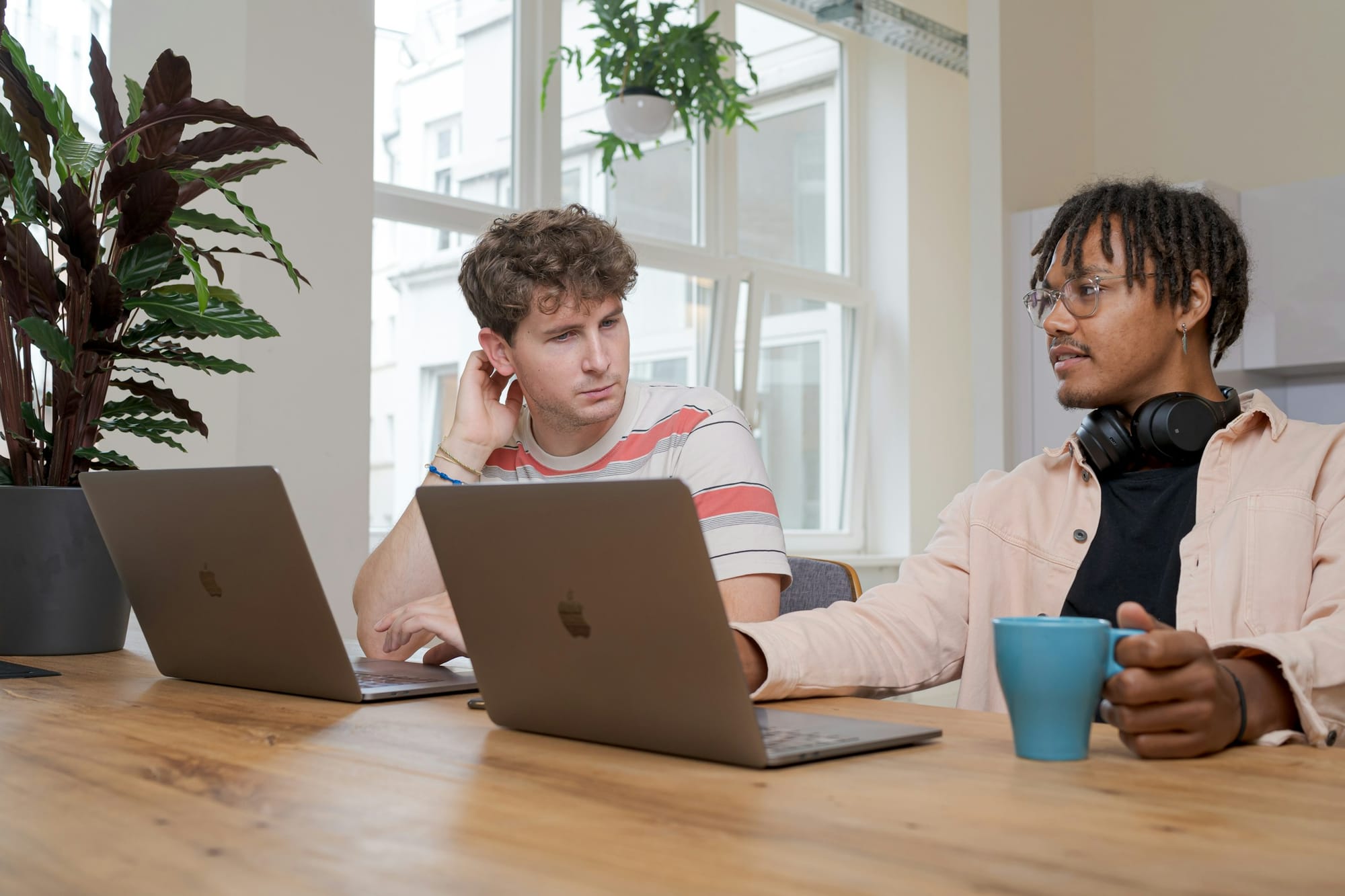 students on a laptop - AI Development Cost
