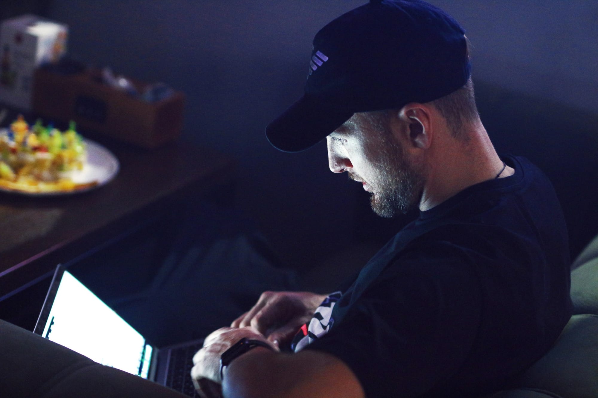 man on a laptop - Gen AI vs AI
