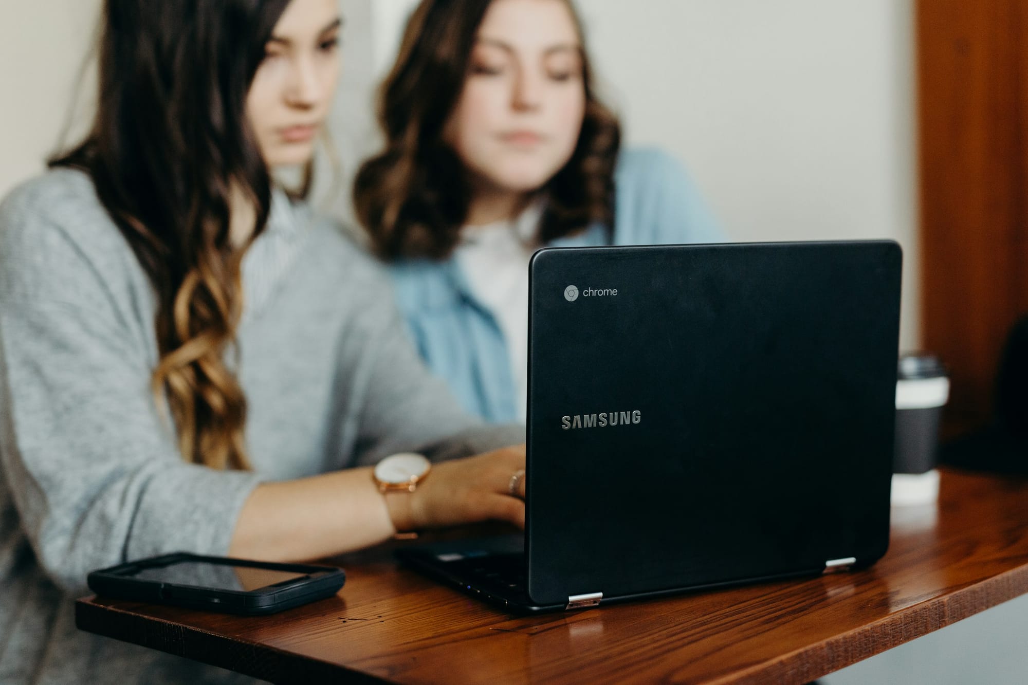 women on a laptop - How To Create an AI App