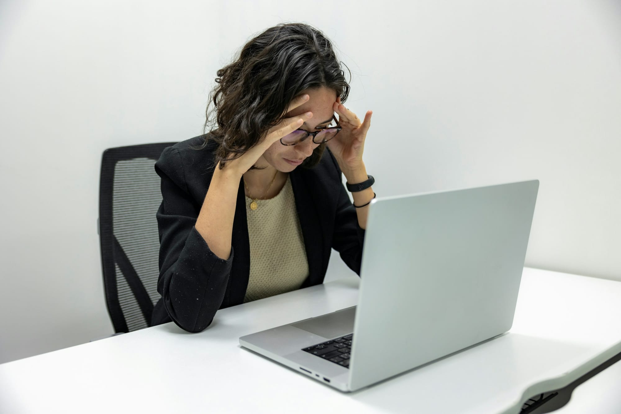 woman worried looking at laptop - 