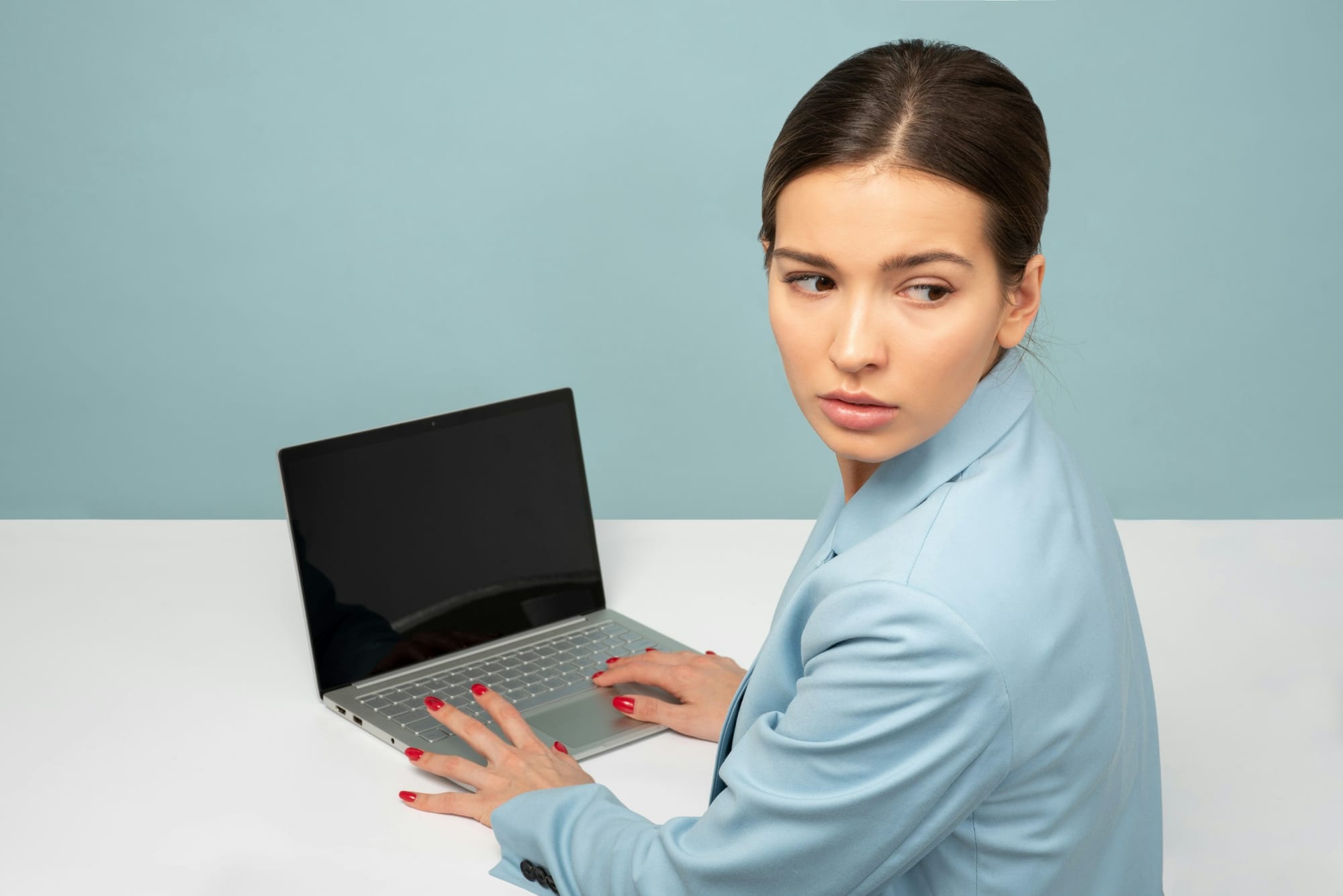 woman looking worried on laptop - LLM Distillation