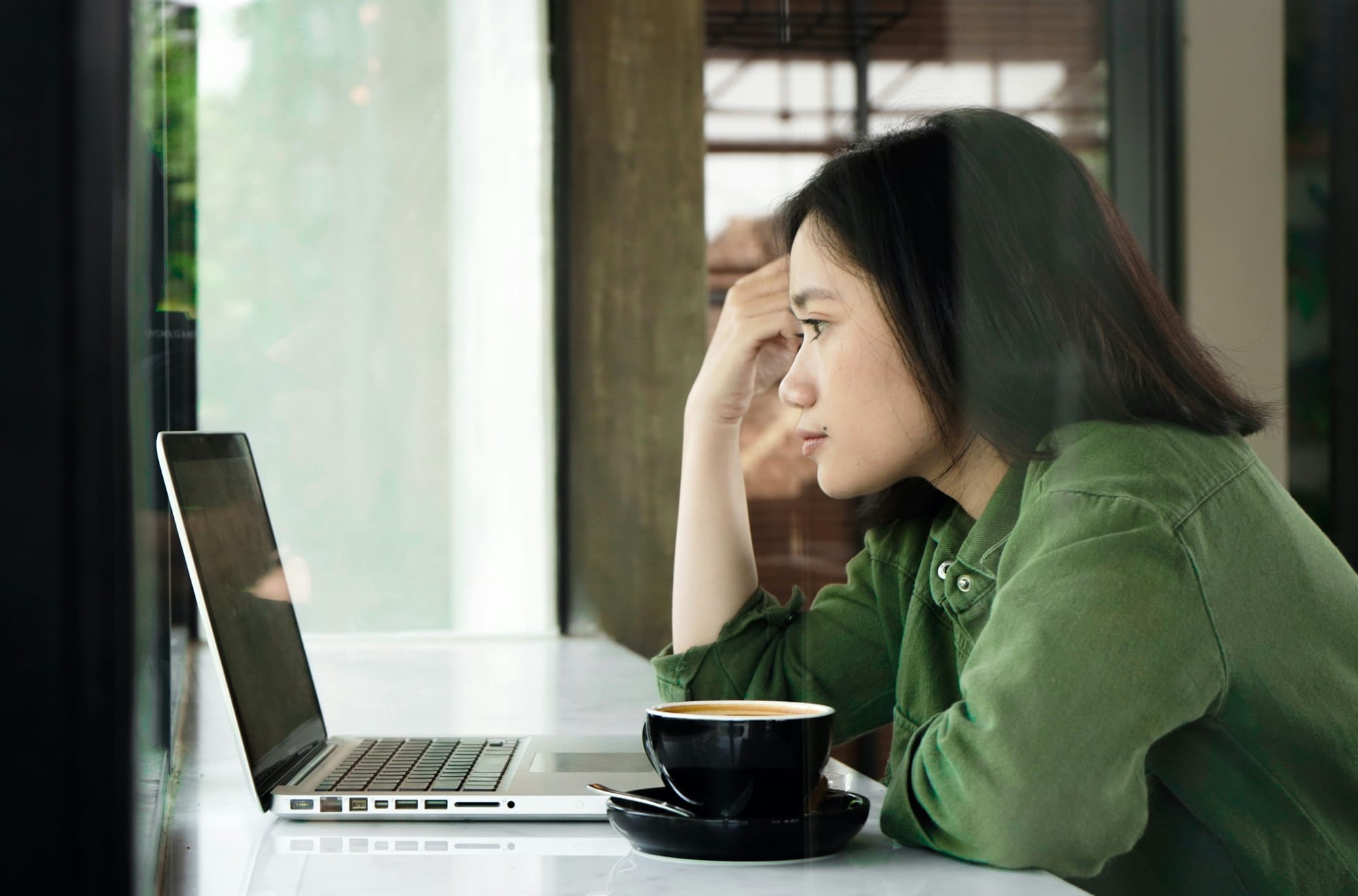 woman looking at a laptop - Amazon Lex Alternatives