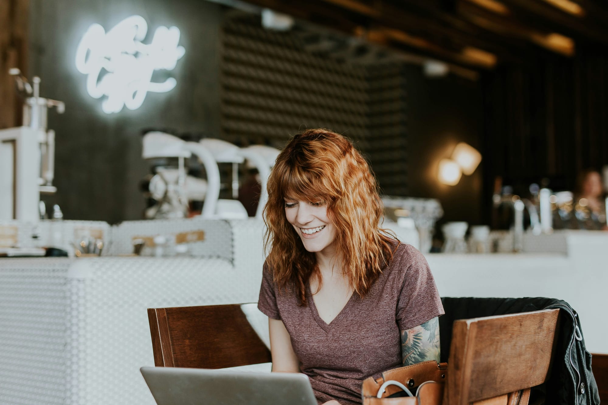 woman working on laptop -  Crewai vs Langchain