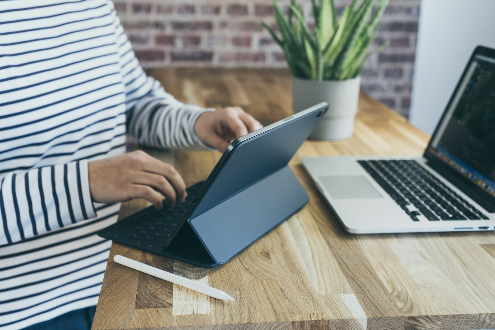 person with laptop infront of her - How to Build Your Own LLM