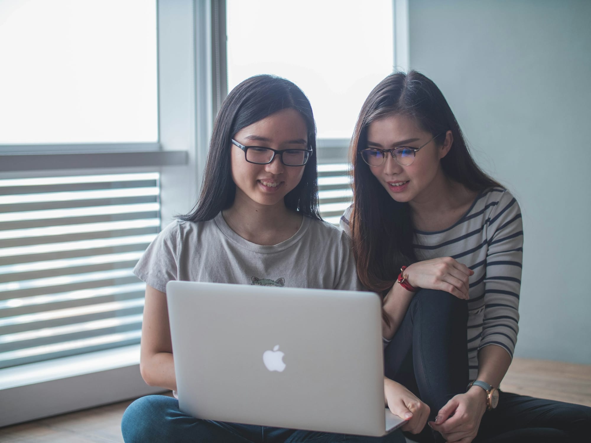 women on a laptop - How to Create Your Own AI Application