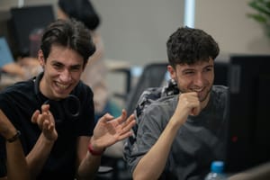 employees smiling - Semantic Kernel vs Langchain 